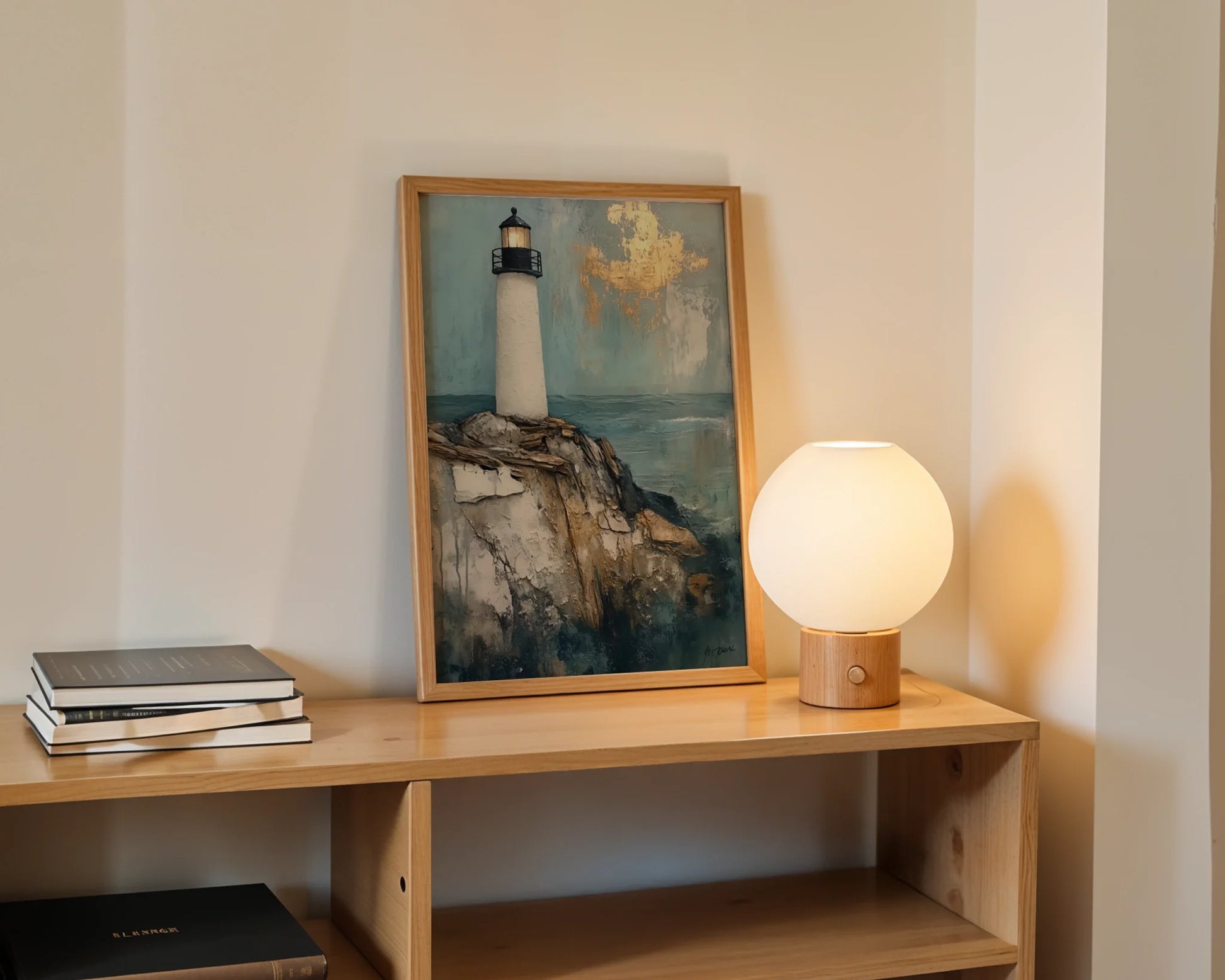 Lighthouse Painting Gold Leaf Clouds Coastal Canvas Wall Art — Harbor sentinel artwork mounted in minimalist dining space for modern coastal home styling