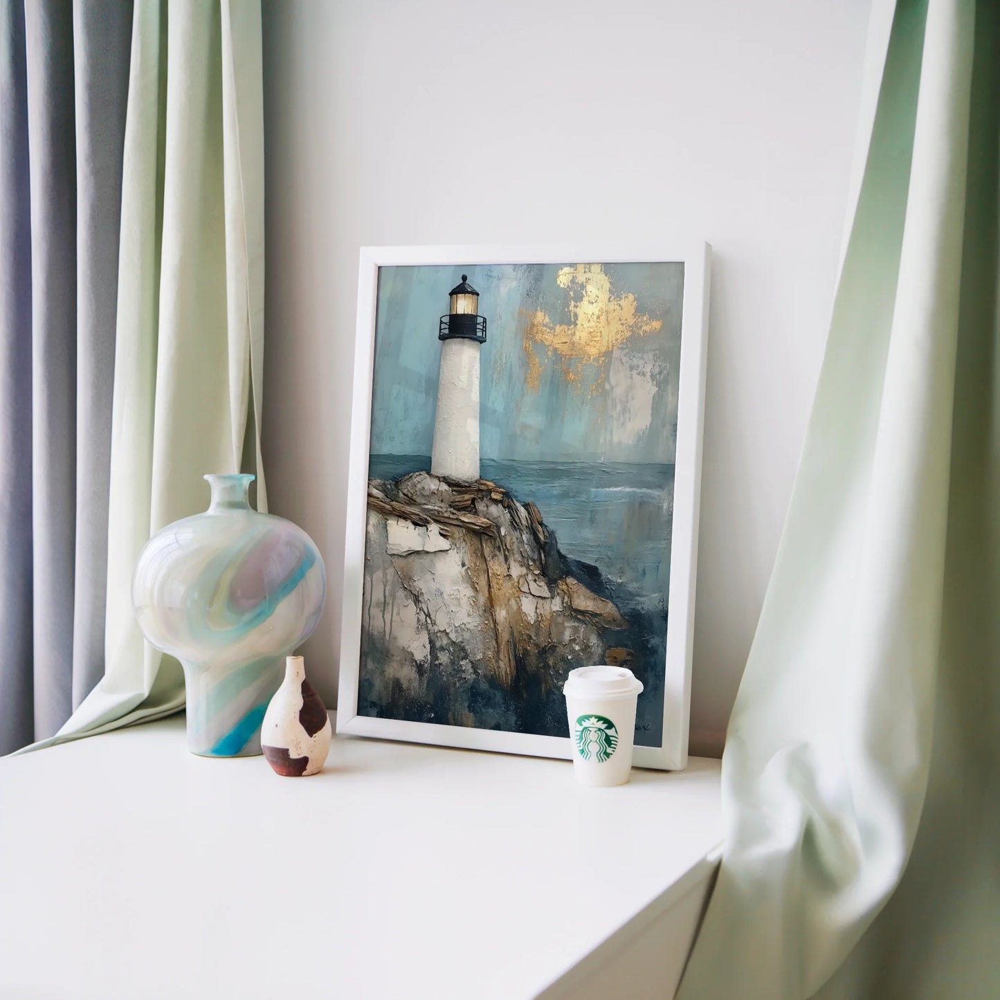 Lighthouse Painting Gold Leaf Clouds Coastal Canvas Wall Art — Turquoise and cream tower canvas with raised brushstrokes displayed in styled home interior