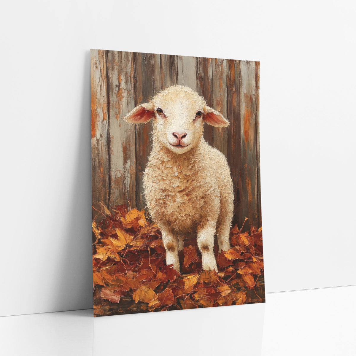 Smiling Lamb Autumn Leaves Farmhouse art print leaning against a white wall – young cream lamb with pink ears standing