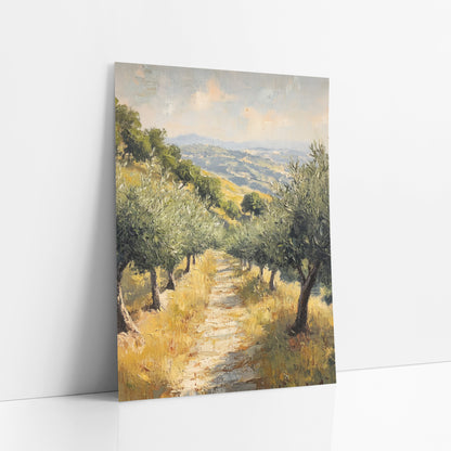 Grassy Path Between Olive Trees art print leaning against a white wall – olive trees line a pale dirt path through golden