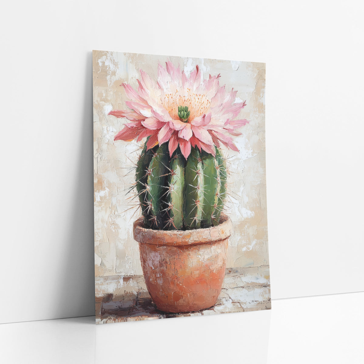 Single Pink Cactus Flower Cracked Plaster art print leaning against a white wall – round green cactus with a large pink