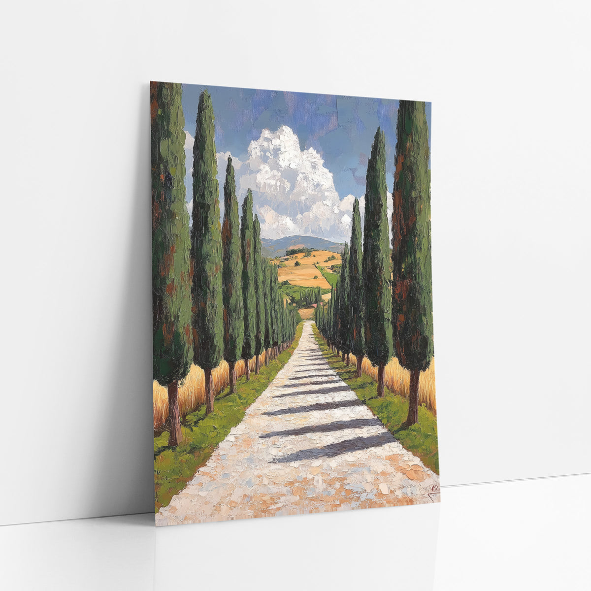 Cypress Lane Mediterranean Landscape art print leaning against a white wall – tall cypress trees line a pale gravel path