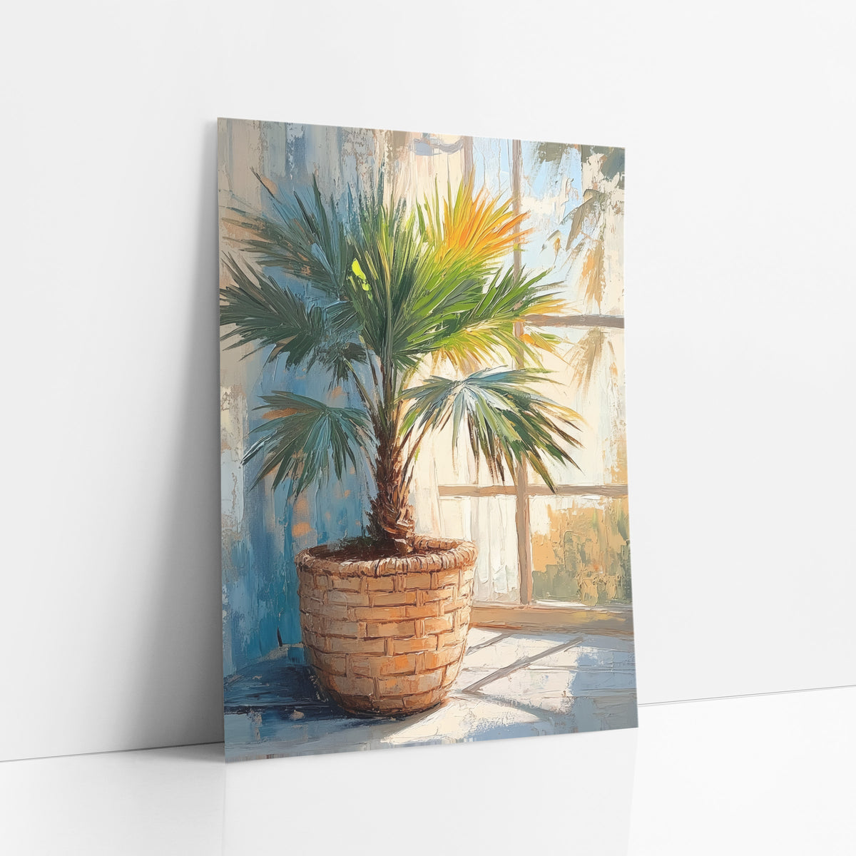 Sunlit Fan Palm Basket Botanical art print leaning against a white wall – green fan palm in a woven basket beside a sunlit