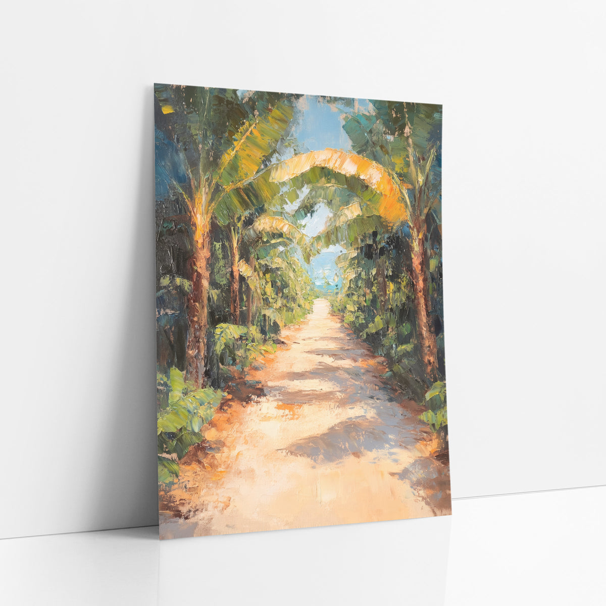 Sunlit Banana Grove Path Tropical art print leaning against a white wall – sandy path winding between banana trees