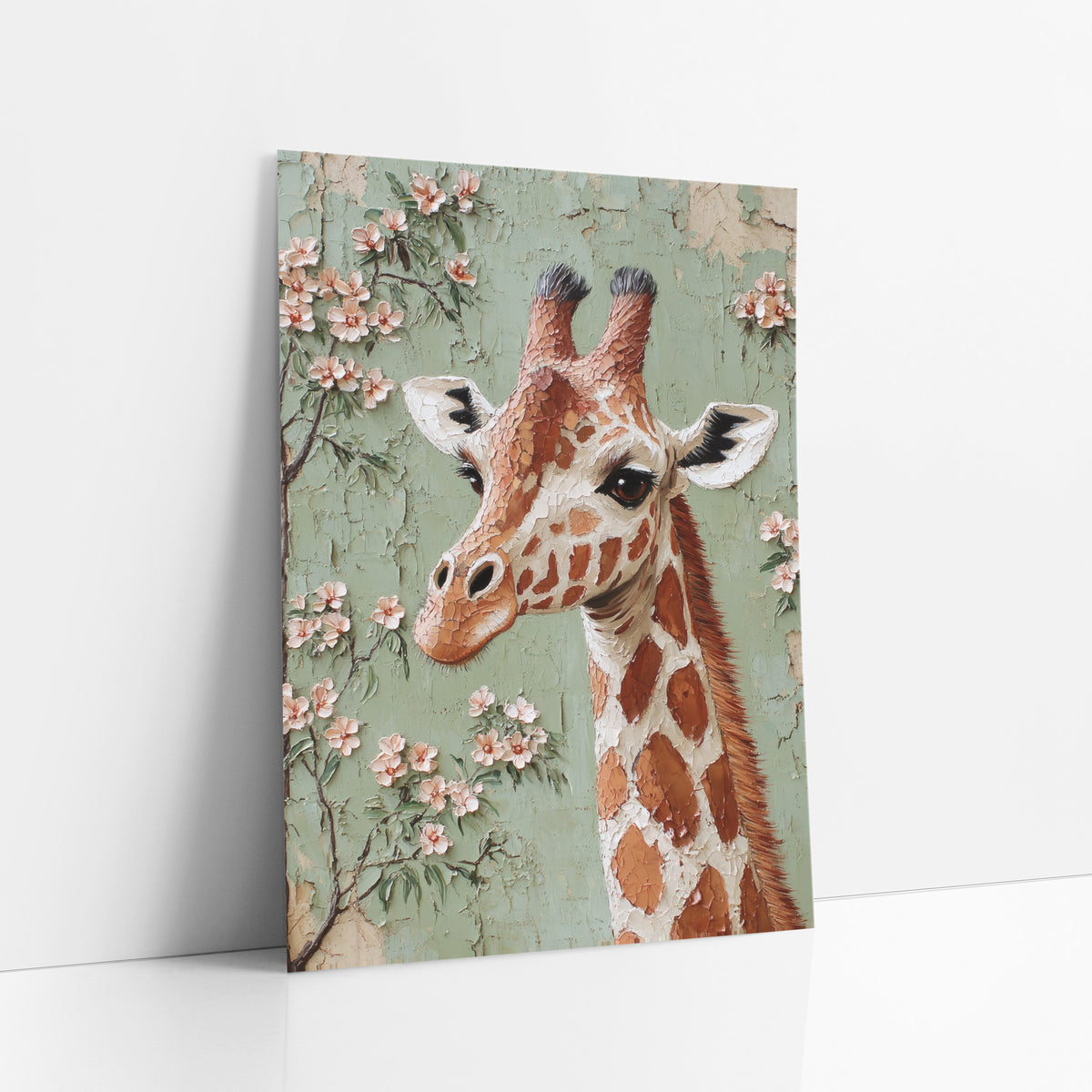 Blossom Giraffe Portrait Boho art print leaning against a white wall – giraffe head and neck beside branches of pink blossoms