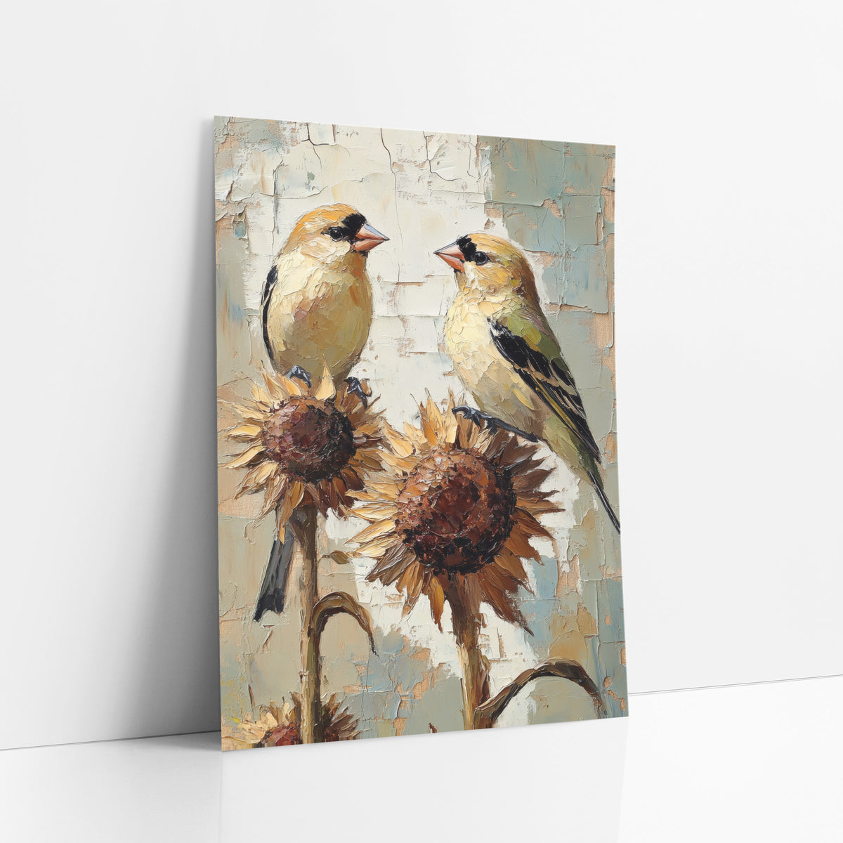 Goldfinch Pair on Sunflowers Boho art print leaning against a white wall – two yellow goldfinches face each other on dried