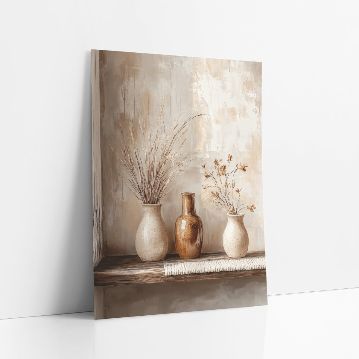 Neutral Ceramic Vase Trio Boho art print leaning against a white wall – three cream and amber ceramic vases with dried
