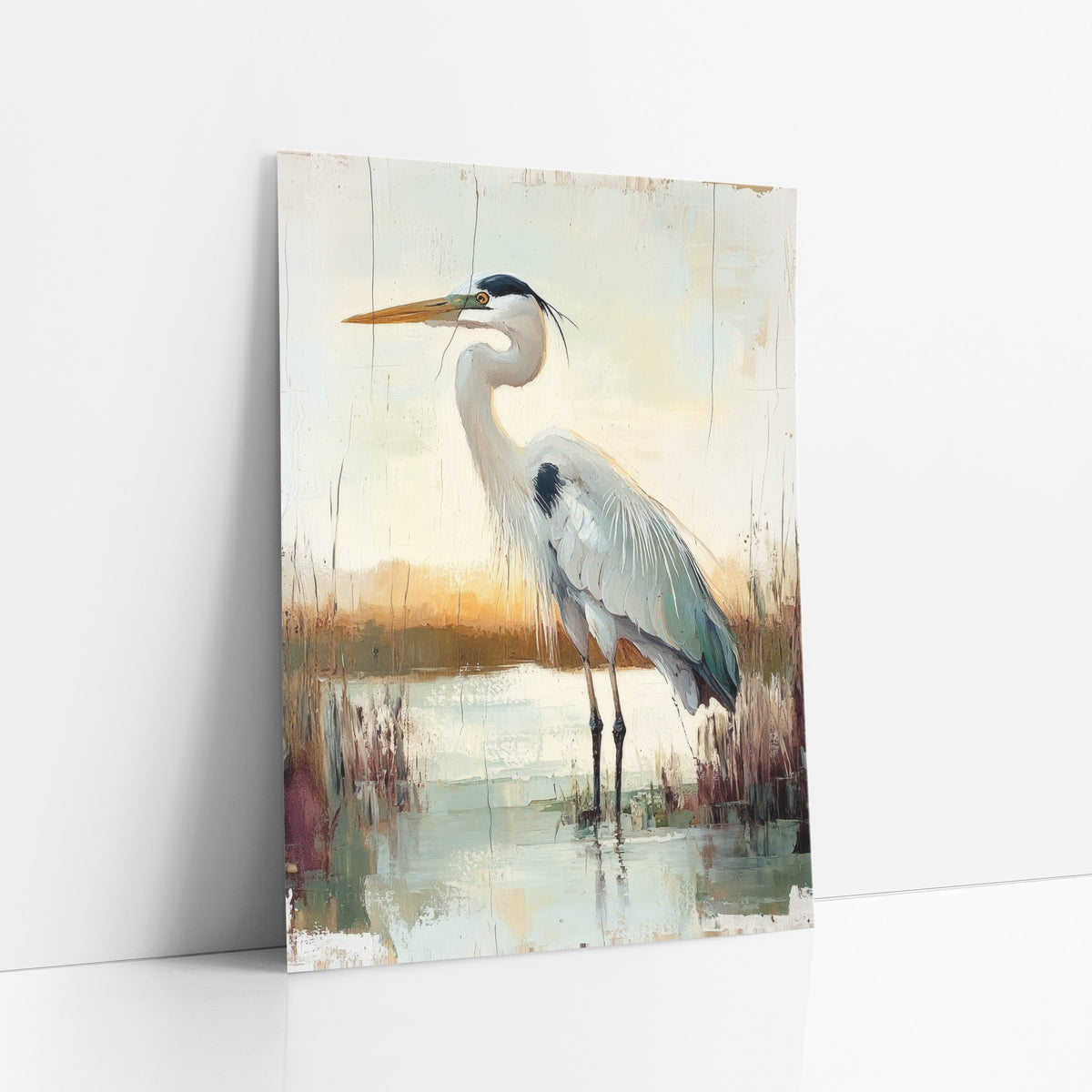 Standing Heron Marsh Boho art print leaning against a white wall – gray heron with orange bill standing in still marsh water