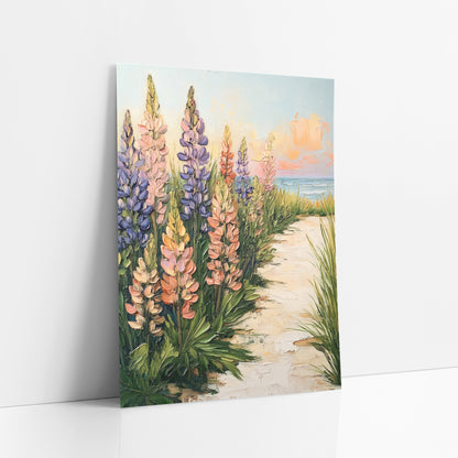 Seaside Lupine Path Bohemian art print leaning against a white wall – tall violet, pink and coral lupines and green beach