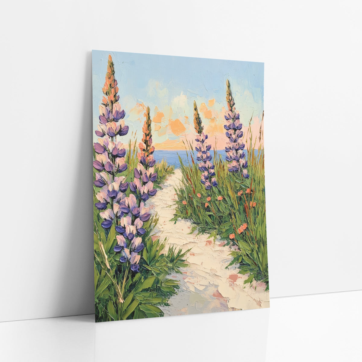 Purple Lupine Seaside Path Boho art print leaning against a white wall – tall purple lupines and green grasses beside a cream