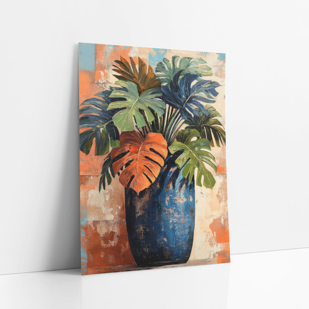 Rust Leaf Cobalt Amphora Monstera art print leaning against a white wall – monstera and palm leaves in green, navy and orange