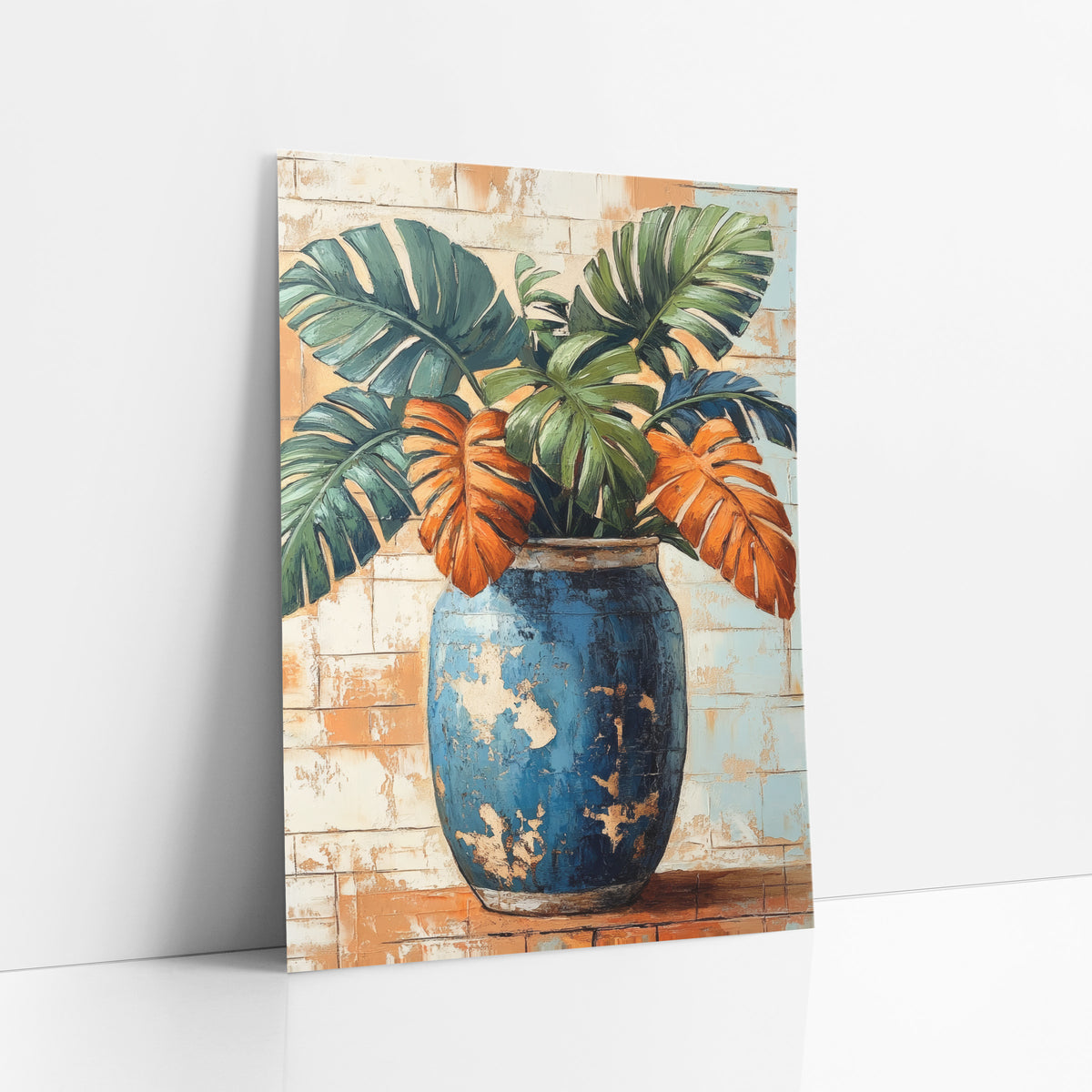 Blue Jar Monstera Leaves Boho art print leaning against a white wall – green, navy and orange monstera leaves in a tall worn