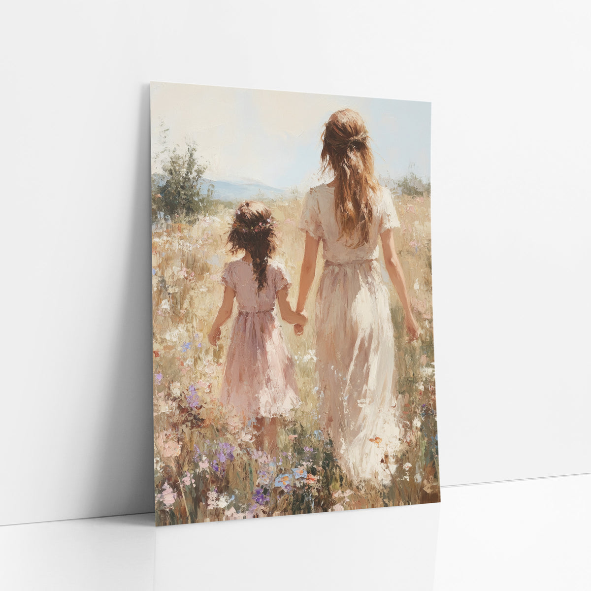 Sunlit Braided Girl Hillside Painterly art print leaning against a white wall – woman in cream dress and girl in pink dress