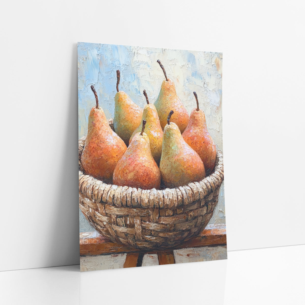 Rustic Pear Basket Boho art print leaning against a white wall – six ripe orange and green pears in a woven basket