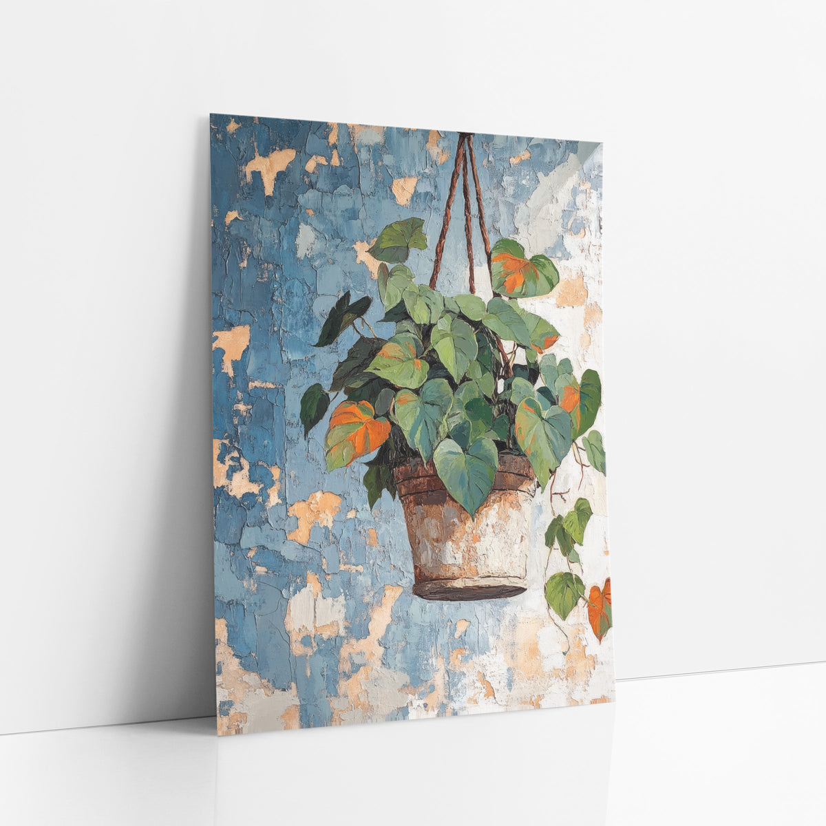 Hanging Heartleaf Plant Boho Botanical art print leaning against a white wall – heart-shaped green and orange leaves trailing