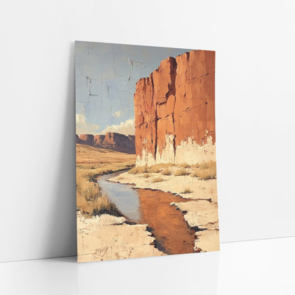 Sandstone Wall Creek Desert Boho art print leaning against a white wall – tall rust-orange cliff beside a winding desert