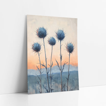 Blue Thistle Sunrise Boho Botanical art print leaning against a white wall – five blue spiky thistle heads on tall stems