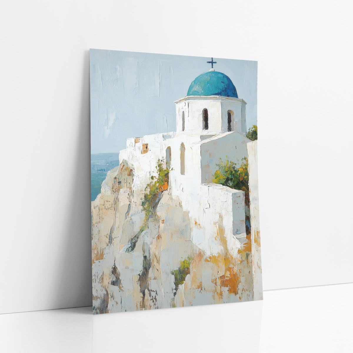 Mediterranean Cliff Chapel Boho art print leaning against a white wall – white chapel with a teal blue dome and dark cross