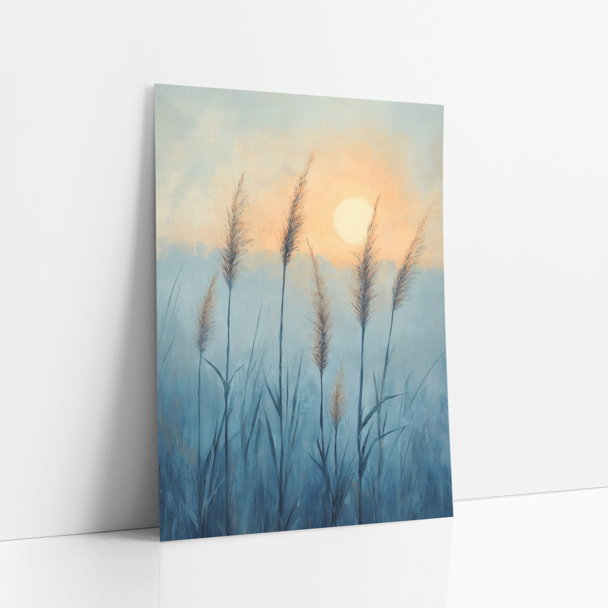 Misty Blue Grass Plumes Boho art print leaning against a white wall – tall feathery grass plumes in a misty blue field