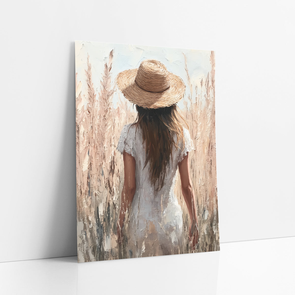 Woman in Straw Hat Pampas Boho art print leaning against a white wall – woman in a straw hat and white dress seen