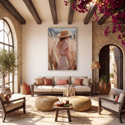 Woman in Pampas Grass Boho wall art in a warm boho-style room – woman in straw hat and blush pink dress seen