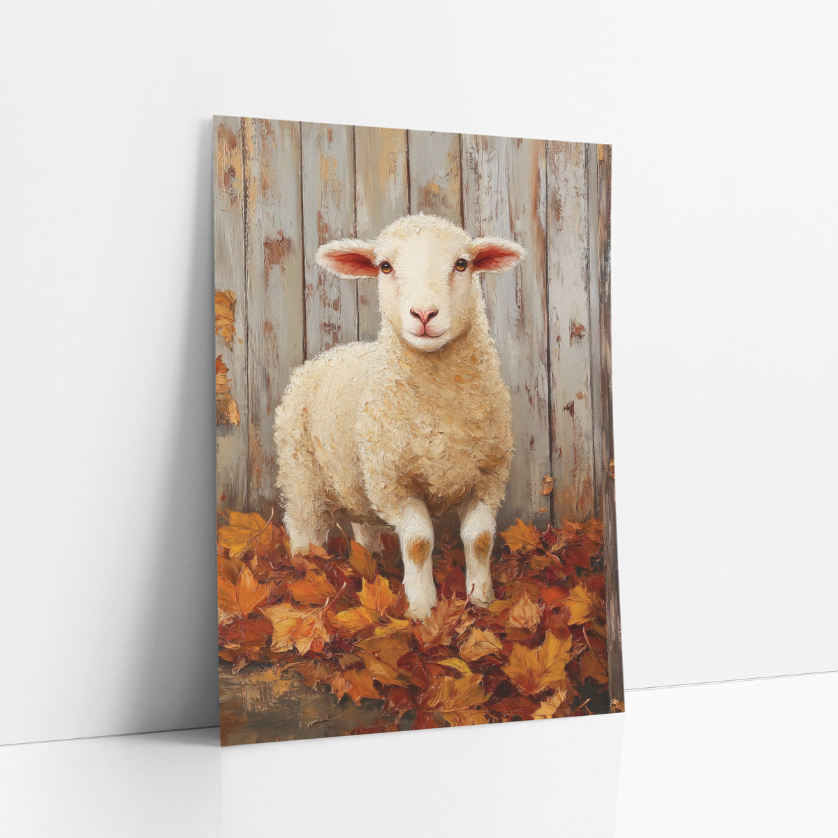 Autumn Lamb Barn Farmhouse art print leaning against a white wall – young white lamb with pink ears standing in orange