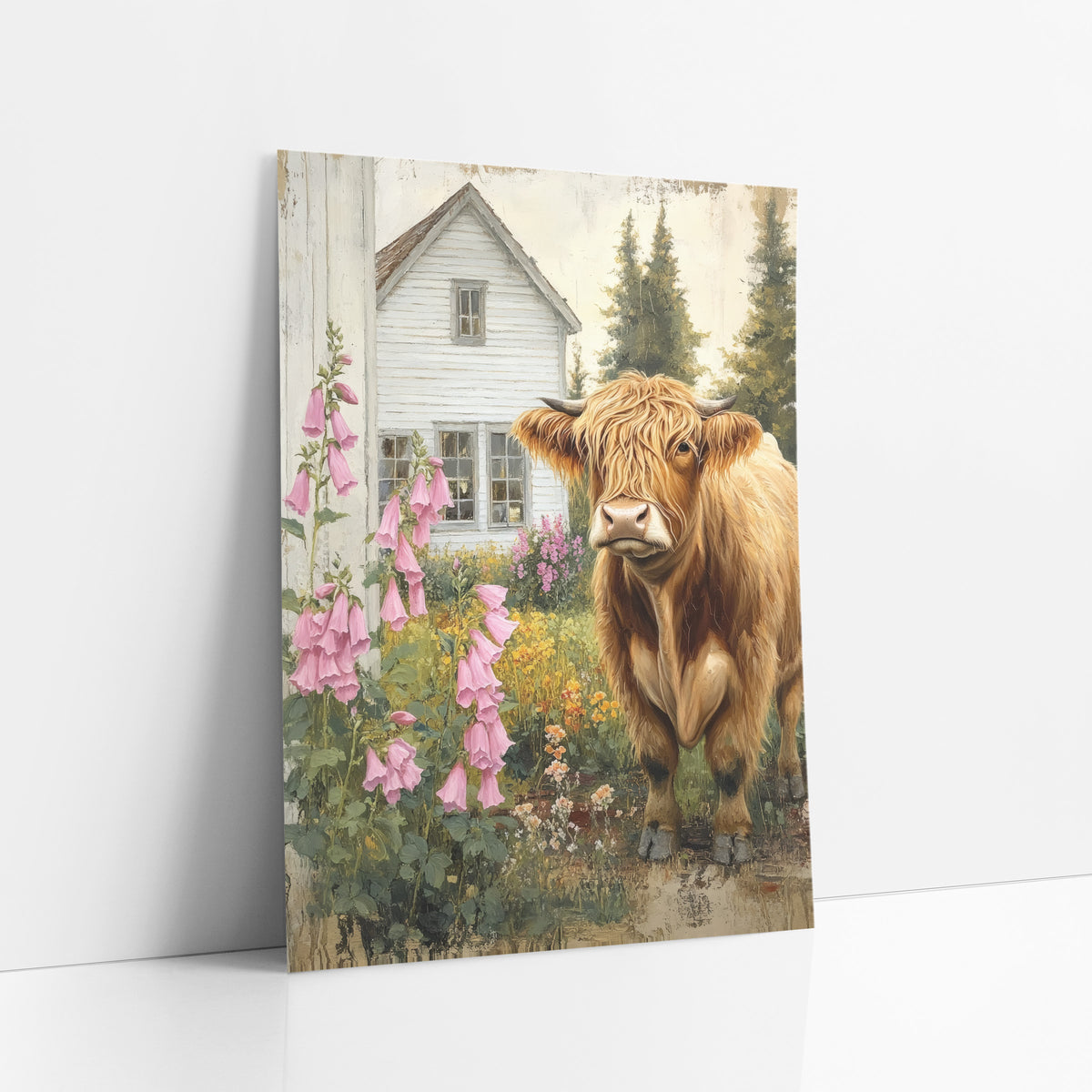 Highland Cow Pink Foxglove Cottage Yard art print leaning against a white wall – golden Highland cow with horns standing