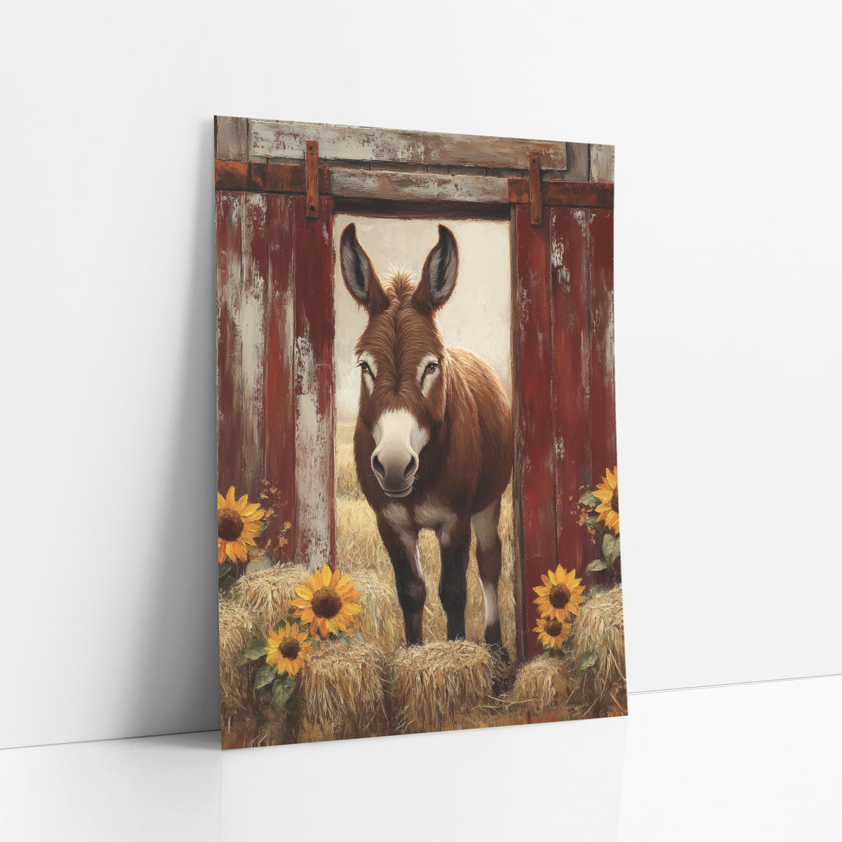 Red Barn Donkey Sunflower Rustic art print leaning against a white wall – brown donkey standing in an open doorway between