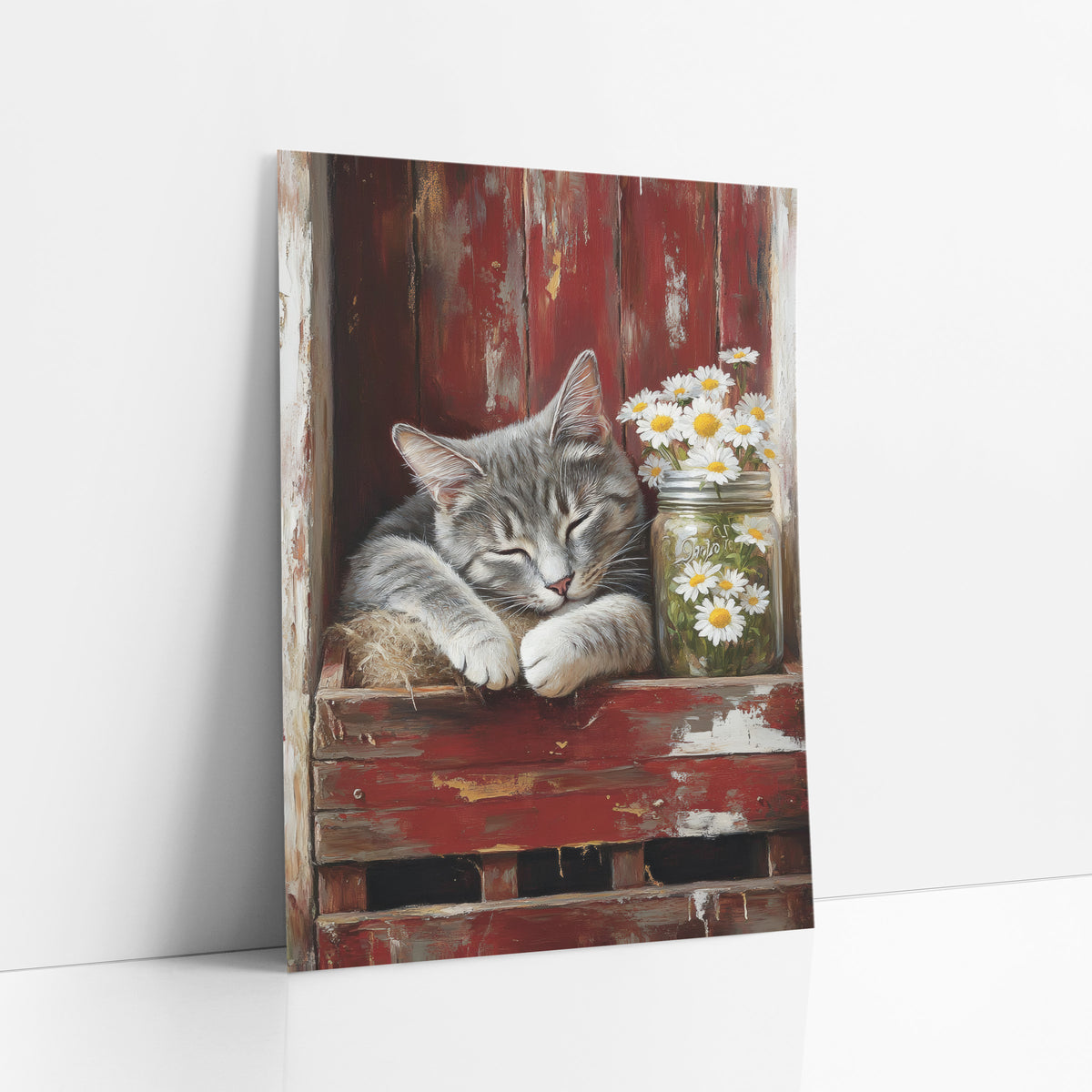 Sleeping Gray Cat Daisy Farmhouse art print leaning against a white wall – gray tabby cat sleeping on straw in a red wooden