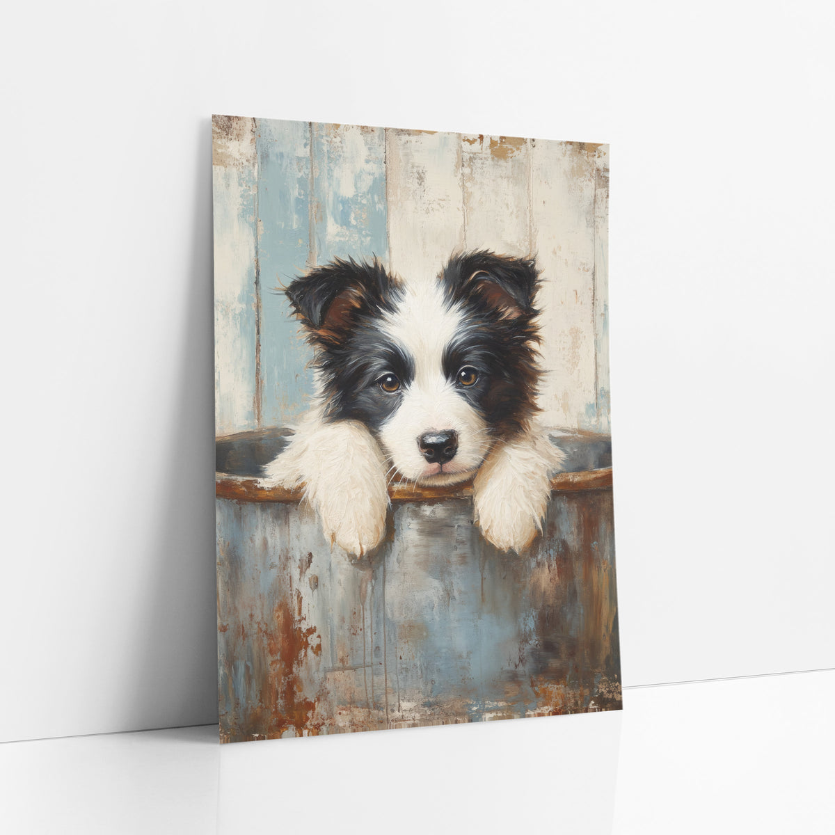 Sleepy Puppy Rusty Tub Farmhouse art print leaning against a white wall – black and white puppy resting white paws on a rusty