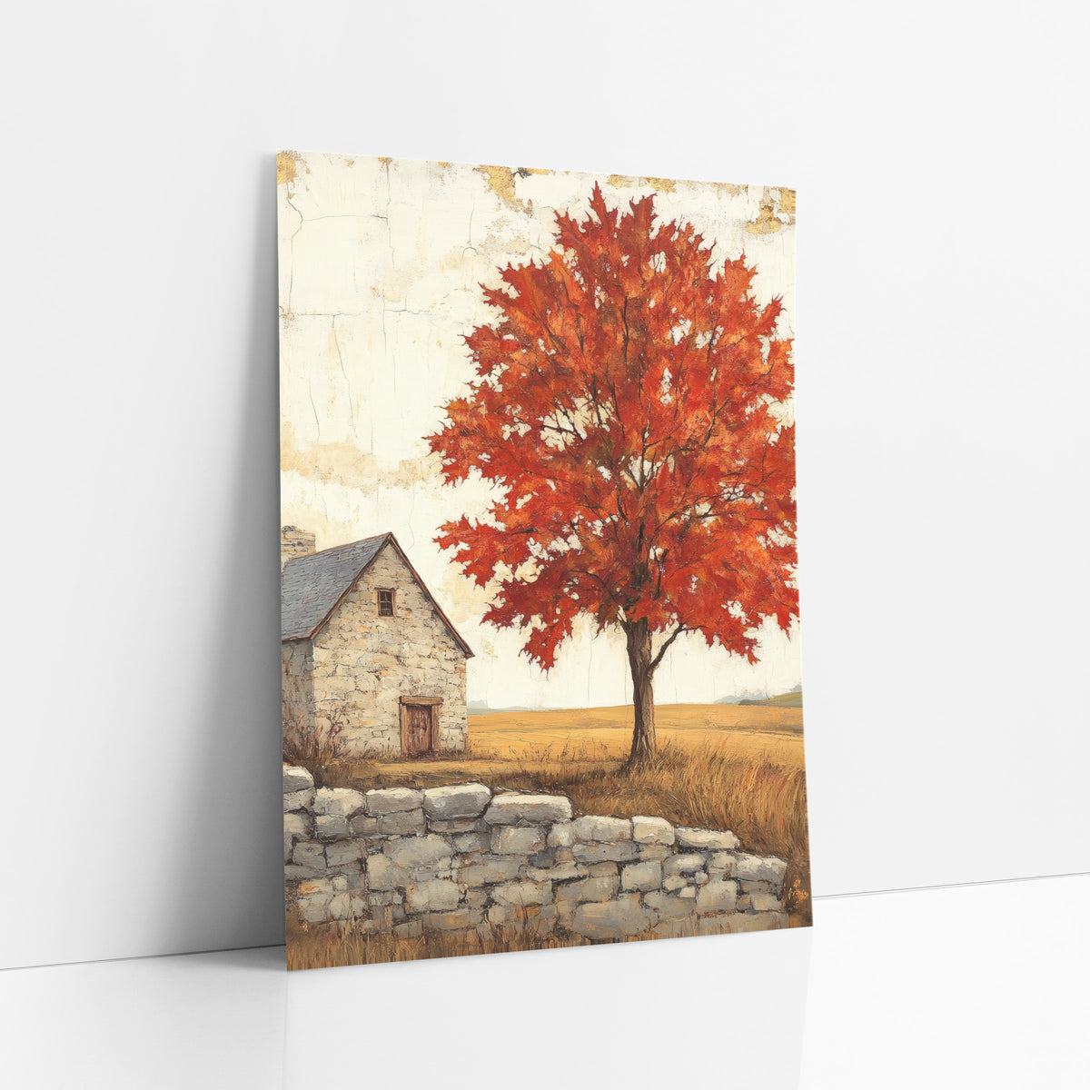 Crimson Maple Slate Roof Cottage art print leaning against a white wall – red maple tree in autumn beside a small stone