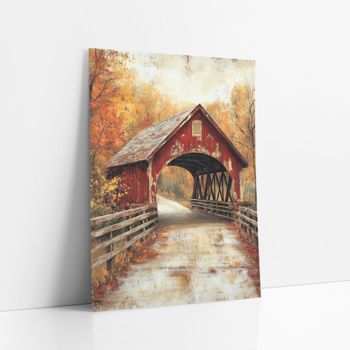 Autumn Covered Bridge Farmhouse Americana art print leaning against a white wall – weathered red covered bridge with timber