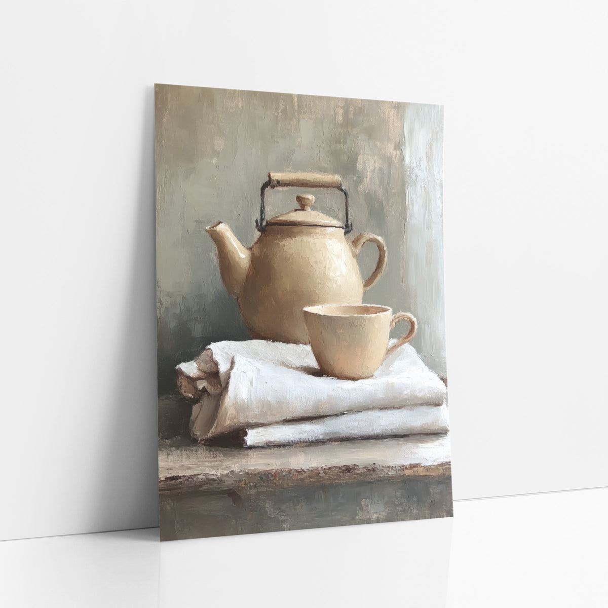 Handled Kettle Linen Stack Still art print leaning against a white wall – cream teapot with black wire handle and matching