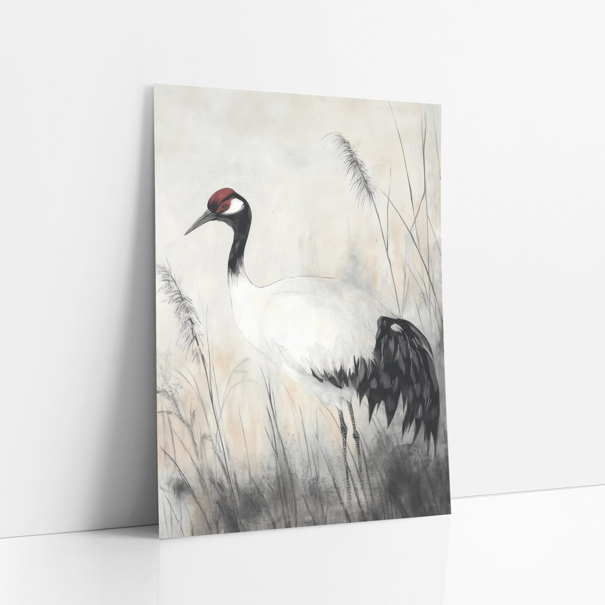 Left Facing Crane Ink Study art print leaning against a white wall – crane with red crown and black tail feathers standing