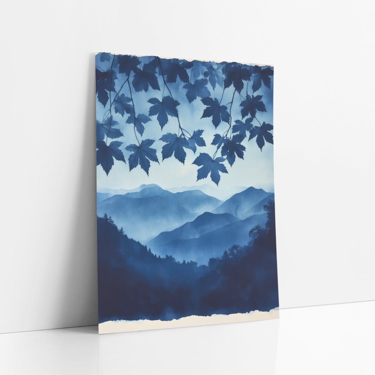 Hanging Maple Canopy Indigo Valley art print leaning against a white wall – indigo maple leaves hanging over layered misty