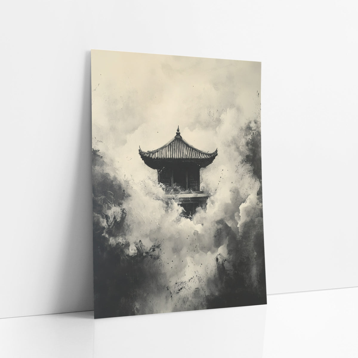 Ink Pagoda Misty Japandi art print leaning against a white wall – small pagoda with curved roof surrounded by billowing black