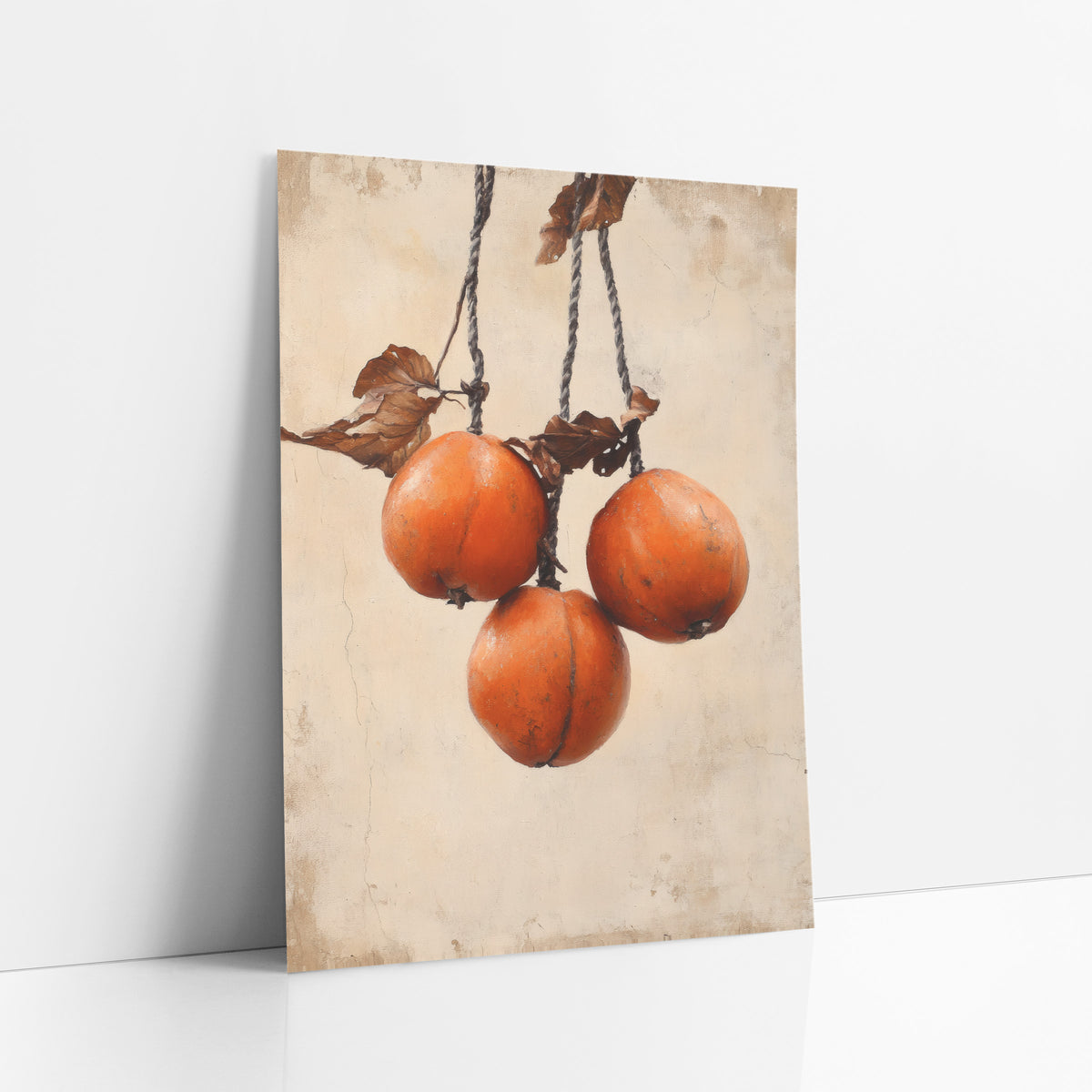 Hanging Persimmons Rustic Japandi art print leaning against a white wall – three orange persimmons hanging from twisted gray