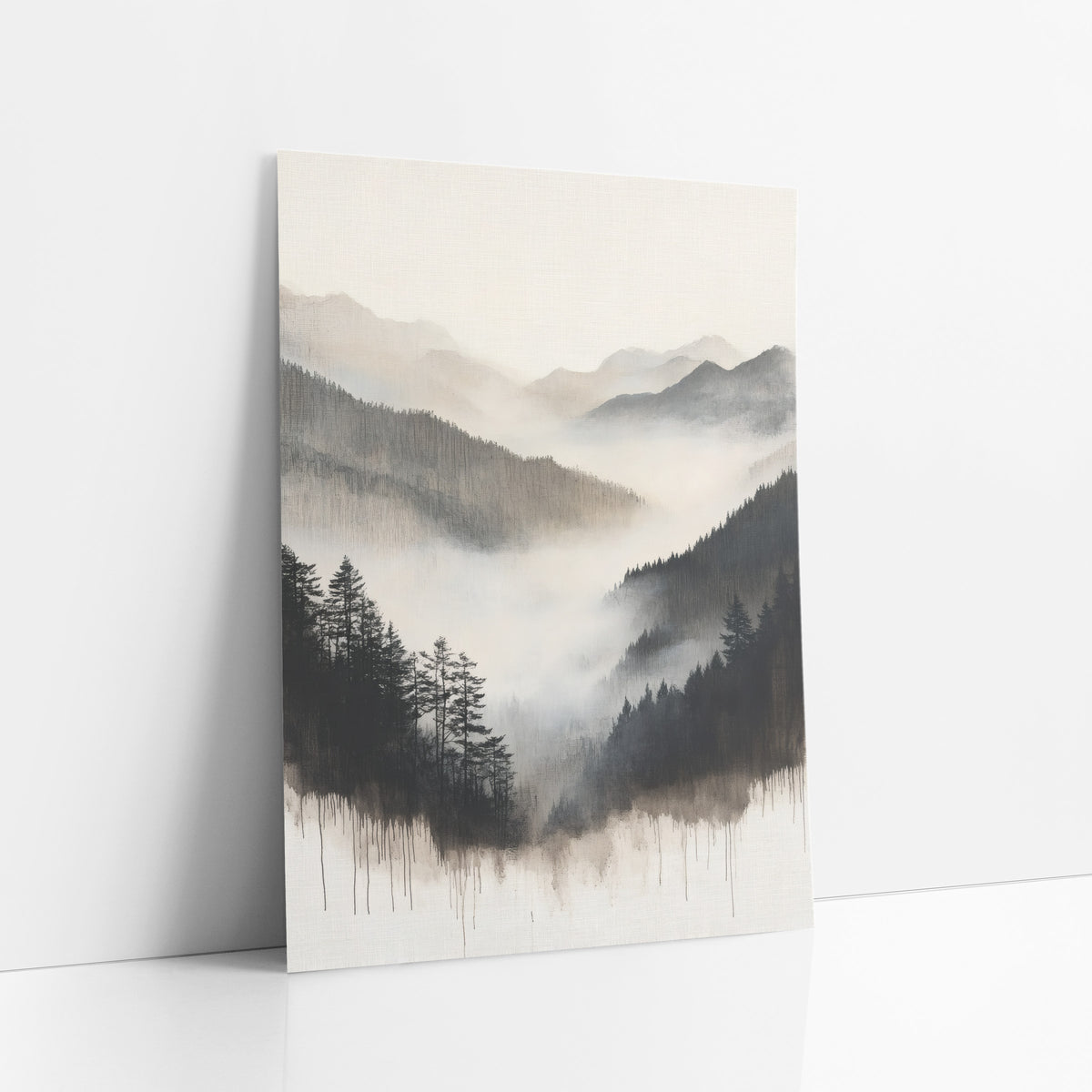 Dripping Ink Pine Valley Sumi art print leaning against a white wall – misty mountain valley with dark evergreens on both