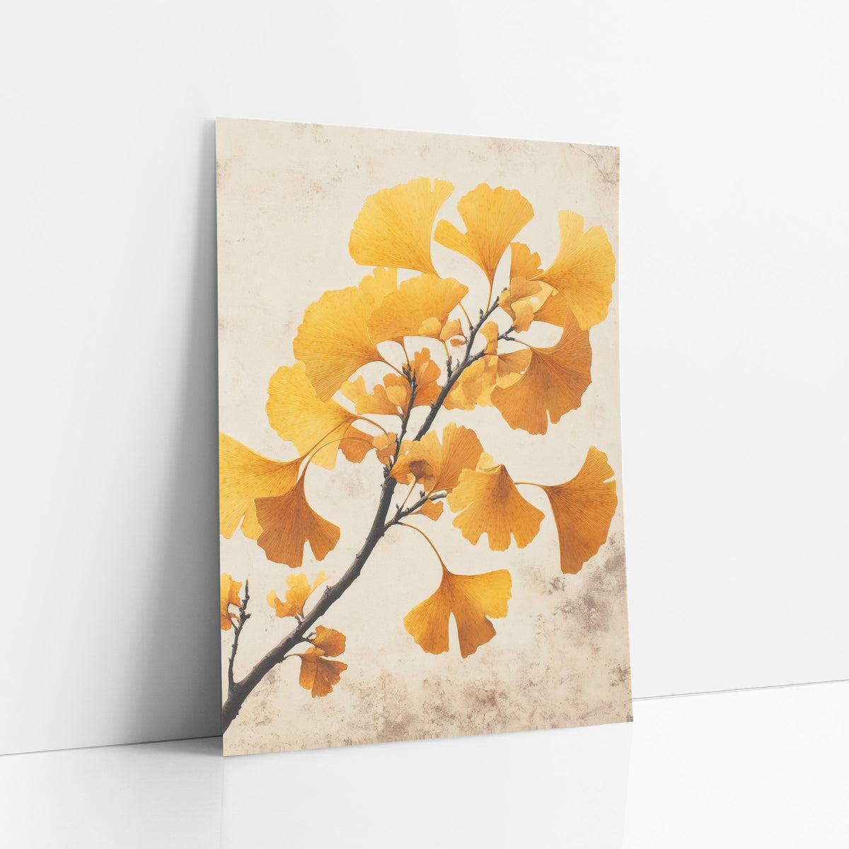 Ginkgo Crackled Parchment Study art print leaning against a white wall – ginkgo branch with golden yellow and amber