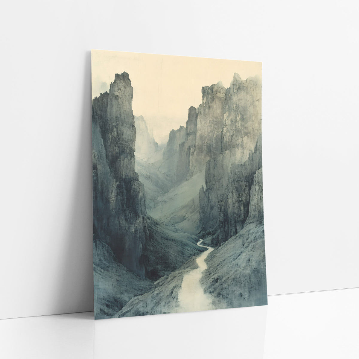 Misty Gorge Pass Landscape art print leaning against a white wall – narrow pale path winding through a misty mountain gorge