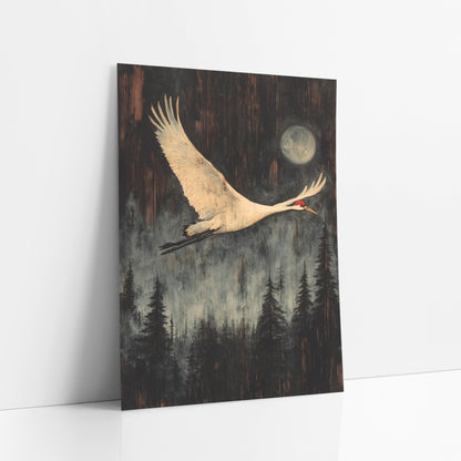 Moonlit Crane Forest Japandi art print leaning against a white wall – white crane with red crown flying past a pale moon