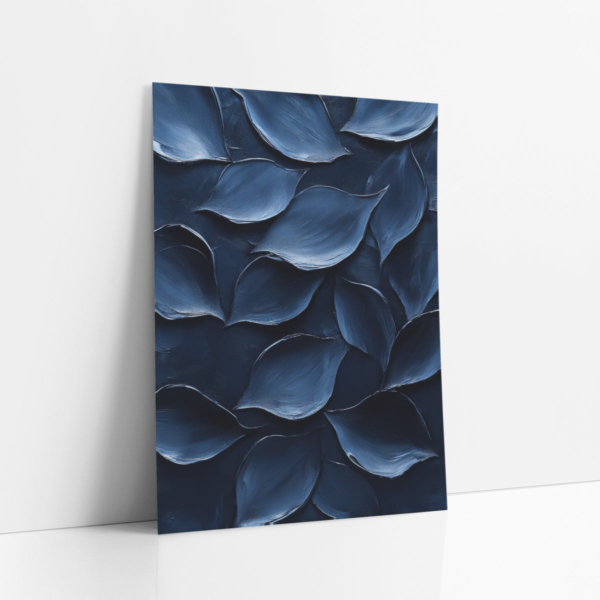 Midnight Blue Petal Forms Abstract art print leaning against a white wall – abstract overlapping petal shapes in navy