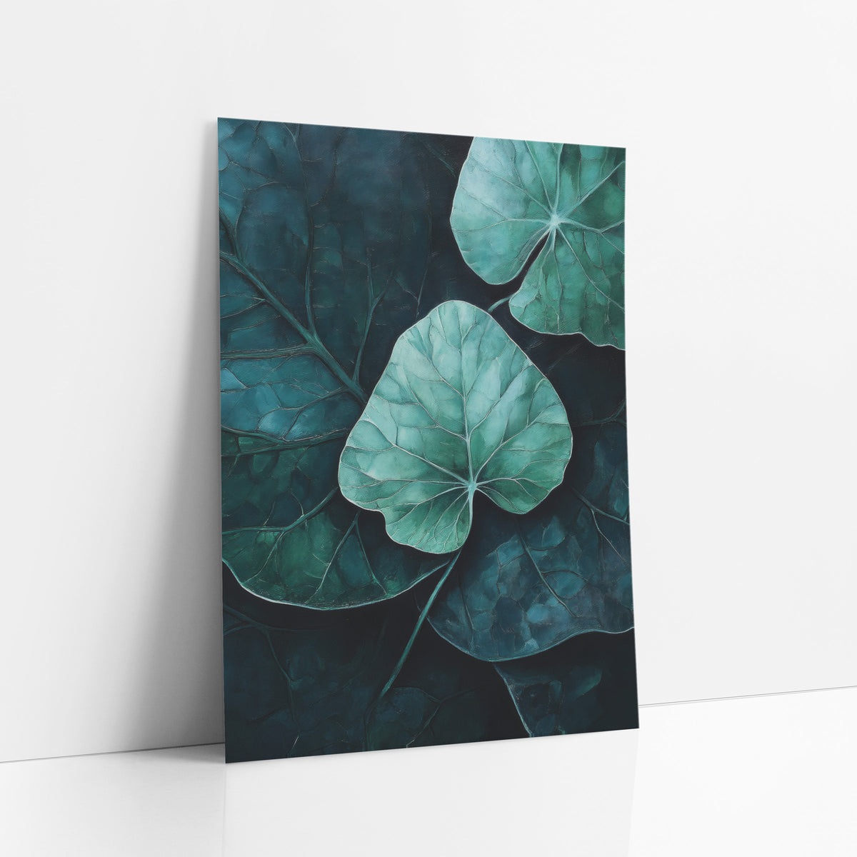 Moody Teal Leaf Botanical Decor art print leaning against a white wall – mint green leaf with pale veins at center