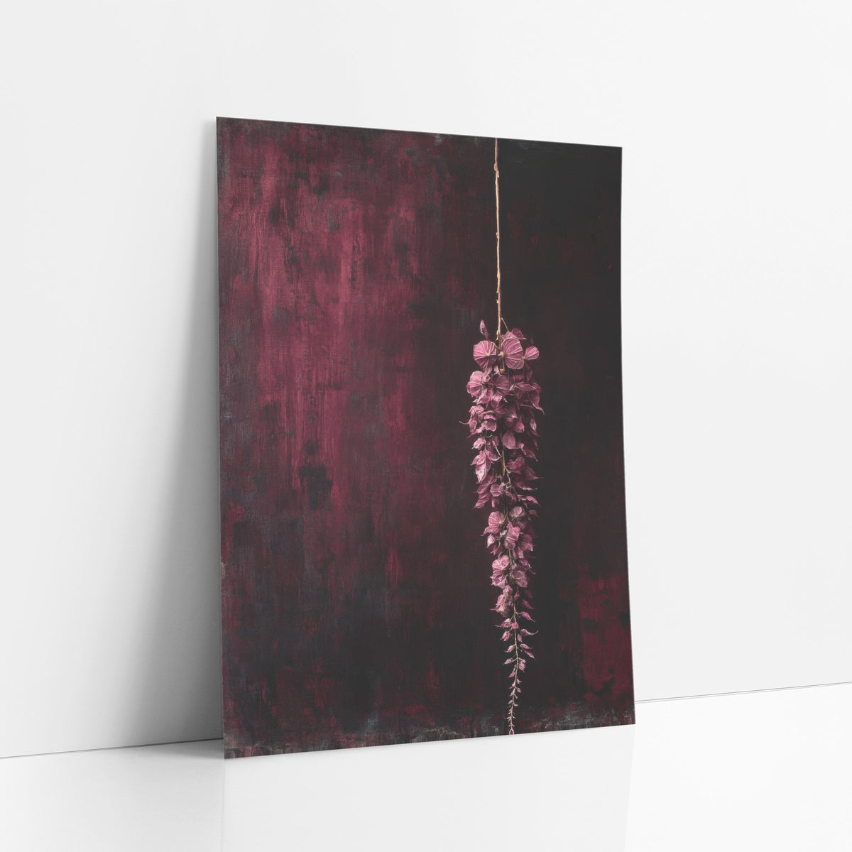 Hanging Burgundy Tassel Moody Botanical art print leaning against a white wall – hanging tassel of plum-pink flowers