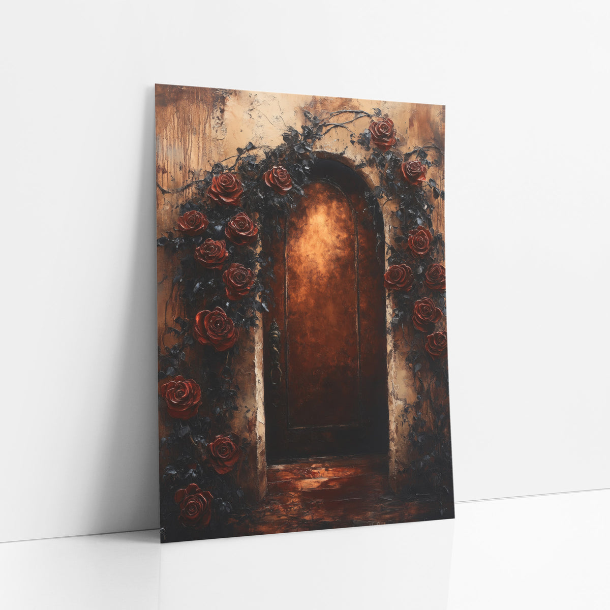 Dark Rose Arched Doorway Gothic art print leaning against a white wall – arched wooden door glowing amber, framed by deep red