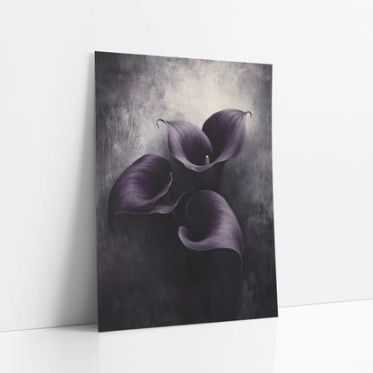 Violet Callas Overhead View Dripping art print leaning against a white wall – three aubergine purple calla lilies with curled