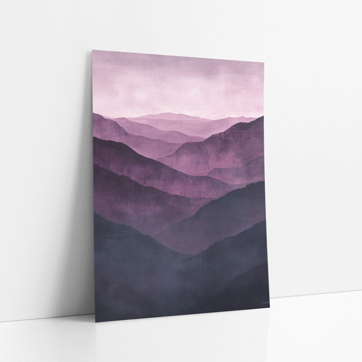 Aubergine Pine Ridges Mist art print leaning against a white wall – layered purple mountain ridges in aubergine and mauve