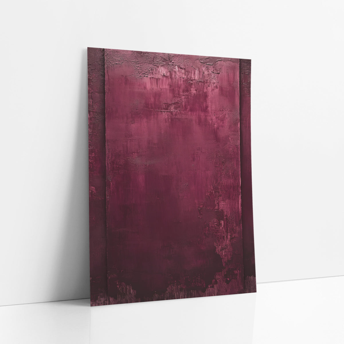 Burgundy Abstract Field Luxe art print leaning against a white wall – burgundy abstract artwork with a wine red field, two