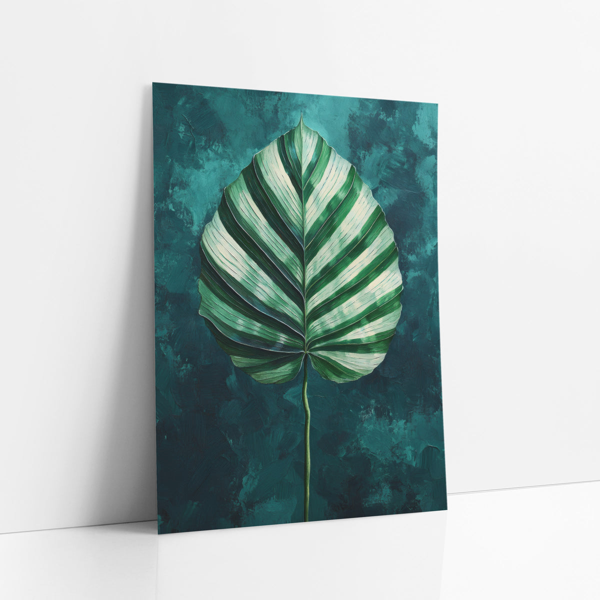Centered Calathea Leaf Teal Painterly art print leaning against a white wall – large heart-shaped leaf with cream and green