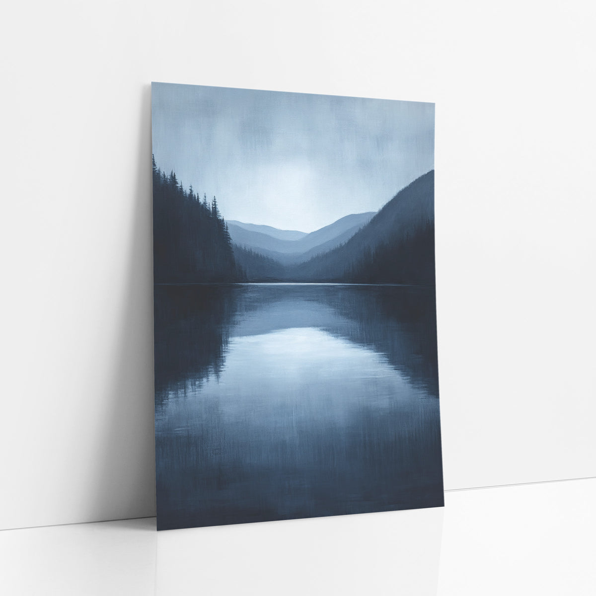 Midnight Blue Mountain Lake Landscape art print leaning against a white wall – still navy blue lake framed by dark evergreens